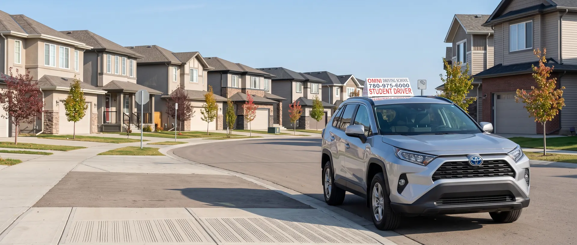 The Omni Driving School car on a new street of family homes and young trees